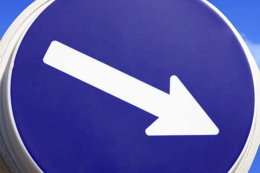 Close up of a road sign with arrow pointing right