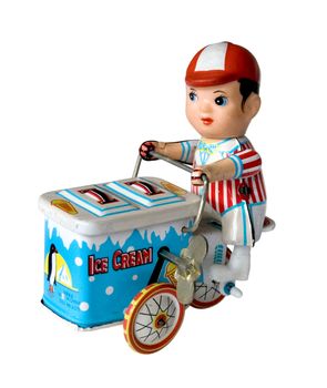 vintage metal toy boy on a three wheeler