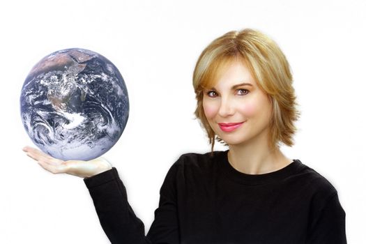 Close-up of a lovely young sandy-blonde woman holding the earth in her right hand.