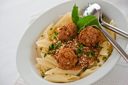 Pasta with tomato garlic sauce and meatballs