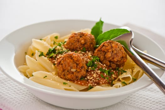 Pasta with tomato garlic sauce and meatballs