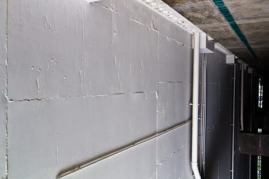 Concrete wall, a table format. And squares.