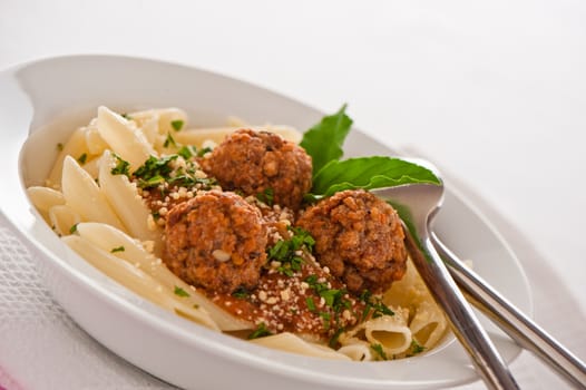 Pasta with tomato garlic sauce and meatballs