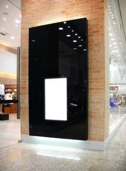 A modern electronic billboard located in a shopping
