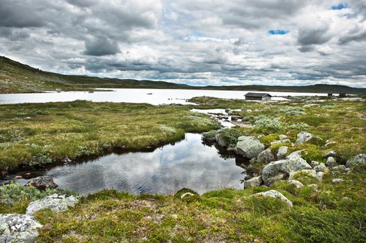 View from the mountain passage Hardangervidda between Bergen and Oslo city in Norway 