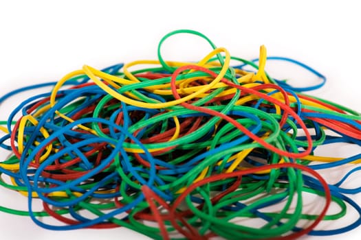 Pile of Multi-Colored Rubber Bands on White Background