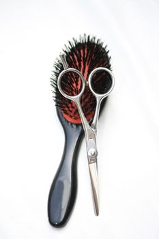 Basic Hairdressers tools - a brush and a stainless steel pair of scissors