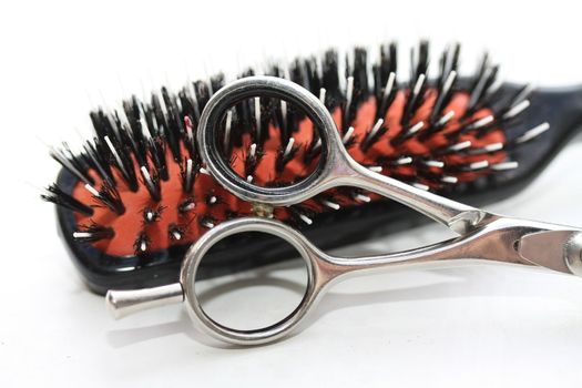 Basic Hairdressers tools - a brush and a stainless steel pair of scissors