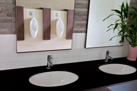 Sinks in the bathroom men a clean and hygienic.