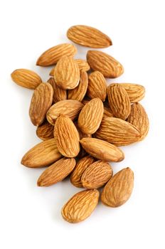 Raw almonds in a pile isolated on white background