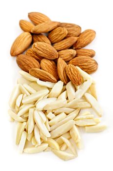 Whole and slivered raw almonds in a pile on white background