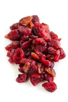 Pile of dried cranberries isolated on white background