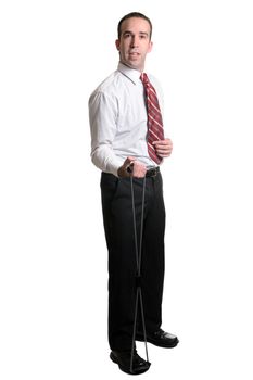 A full length view of an employee using a resistant band to get fit.