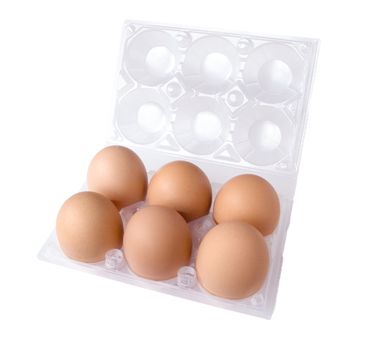 six eggs in a transparent plastic eggbox