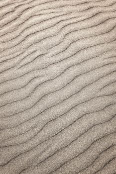 Natural background of sand in ripple wave pattern