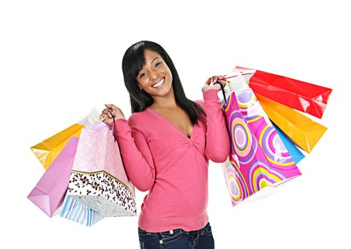 Young smiling black woman holding colorful shopping bags