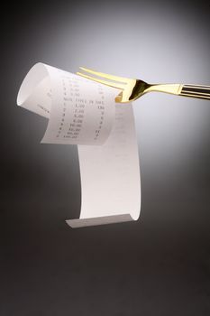 stock image of fork with the receipt on it