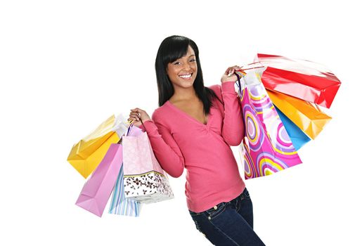 Young smiling black woman holding colorful shopping bags