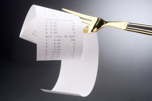 stock image of fork with the receipt on it