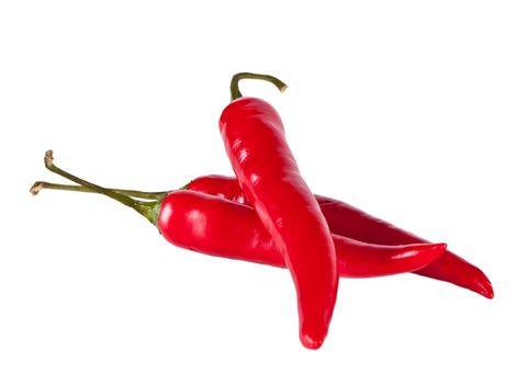 Peppers lie on the white table. Vegetables on a white background.