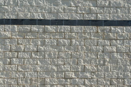 A Stone block wall with stripe background