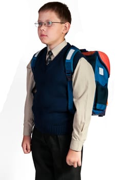 Schoolboy. Isolated over white background. The boy is dressed in a vest.