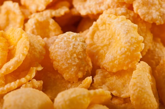 Goldish corn flakes. Macro with extremely shallow dof. Close-up of cornflakes.