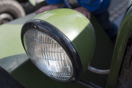 High resolution image. Close up of vintage car. Headlight.