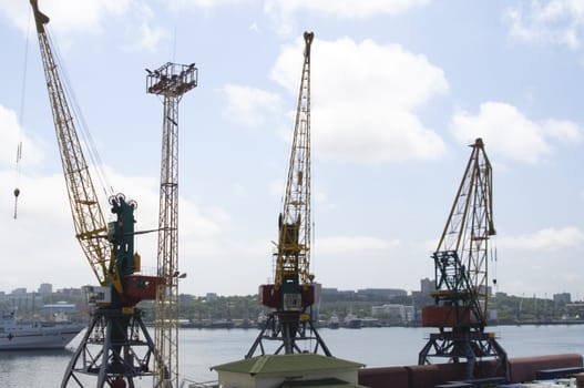 The loading crane in port of a city of Vladivostok.