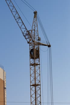 High resolution image. The elevating crane builds the house.