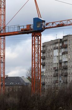 Crane loader lifting a load at construction site