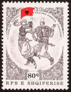 The scanned stamp. Dancers appear on stage. The Albanian stamp.