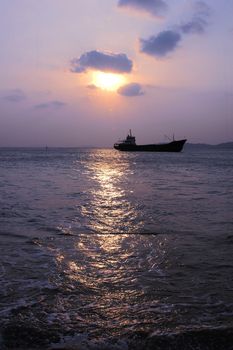 Scenery of ship in the sea at dusk