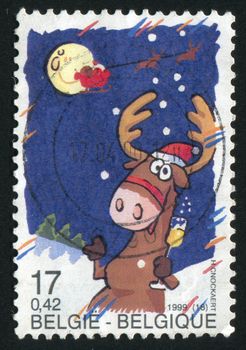 BELGIUM - CIRCA 1999: The cheerful reindeer eats ice-cream, circa 1999.