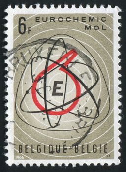 BELGIUM - CIRCA 1966: Atom Symbol and Retort, circa 1966.