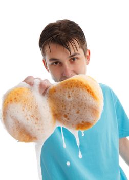 Child holding a sudsy sponge dripping soapy water and bubbles