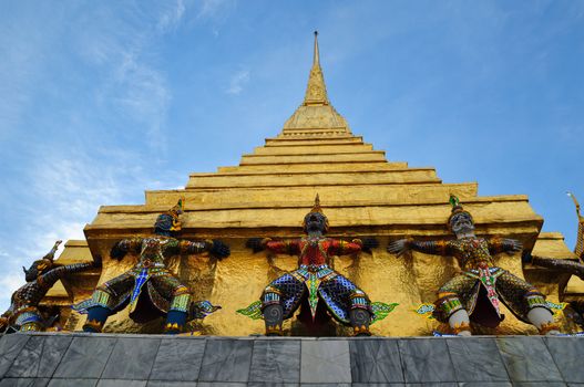 Giant Garuda statue and golden pagoda in Temple of The Emerald Buddha (Wat Phra Kaew), Bangkok, Thailand