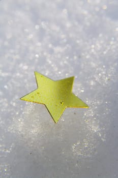 golden snow stars on a real snowy icy surface