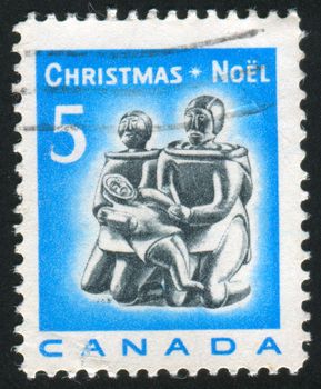 CANADA - CIRCA 1968: stamp printed by Canada, shows Eskimo Family, Carving, circa 1968