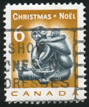 CANADA - CIRCA 1968: stamp printed by Canada, shows Mother and infant, by Munamee of Cape Dorset, circa 1968