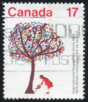 CANADA - CIRCA 1979: stamp printed by Canada, shows Girl Watering Tree, circa 1979