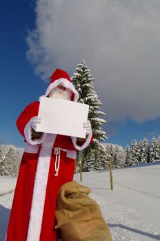 Santa Claus, Father Christmas holding blank sign