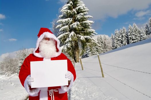 Santa Claus, Father Christmas holding blank sign