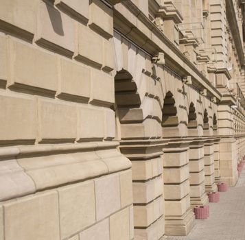 Facade of a city building. City street. A sidewalk part.