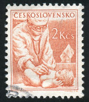 CZECHOSLOVAKIA - CIRCA 1954: stamp printed by Czechoslovakia, shows Physician and baby, circa 1954