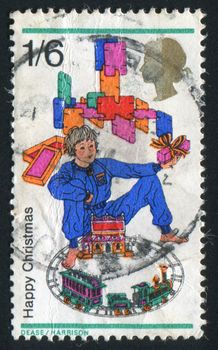 GREAT BRITAIN - CIRCA 1968:  stamp printed by Great Britain, shows Boy with toy train and building blocks, circa 1968.