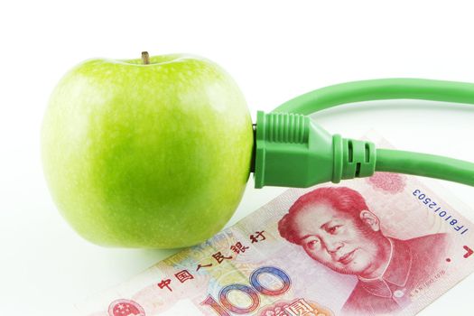 Green apple placed next to Chinese yuan currency emphasize China's fresh support of energy innovation