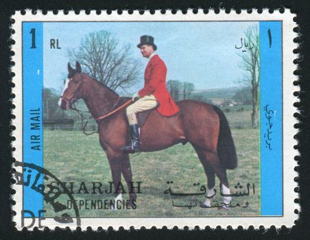 SHARJAH & DEPENDENCIES  - CIRCA 1970: stamp printed by Sharjah, shows person sits on a horse, circa 1970.