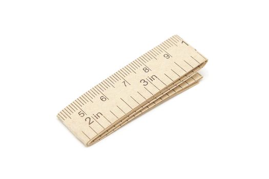 Paper measuring tape with centimeter and inch markings isolated on white