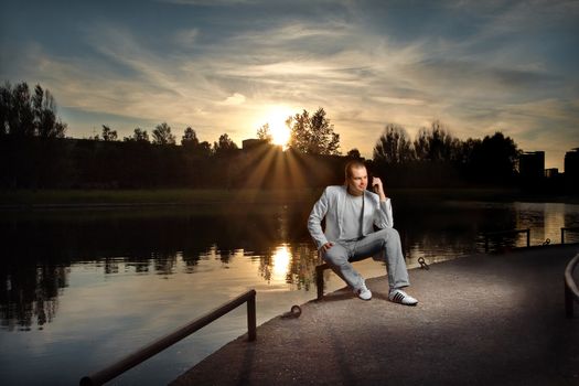 Businessman talking in white on the sunset
